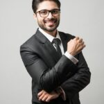 Portrait of indian male businessman standing over white background _ Premium Photo